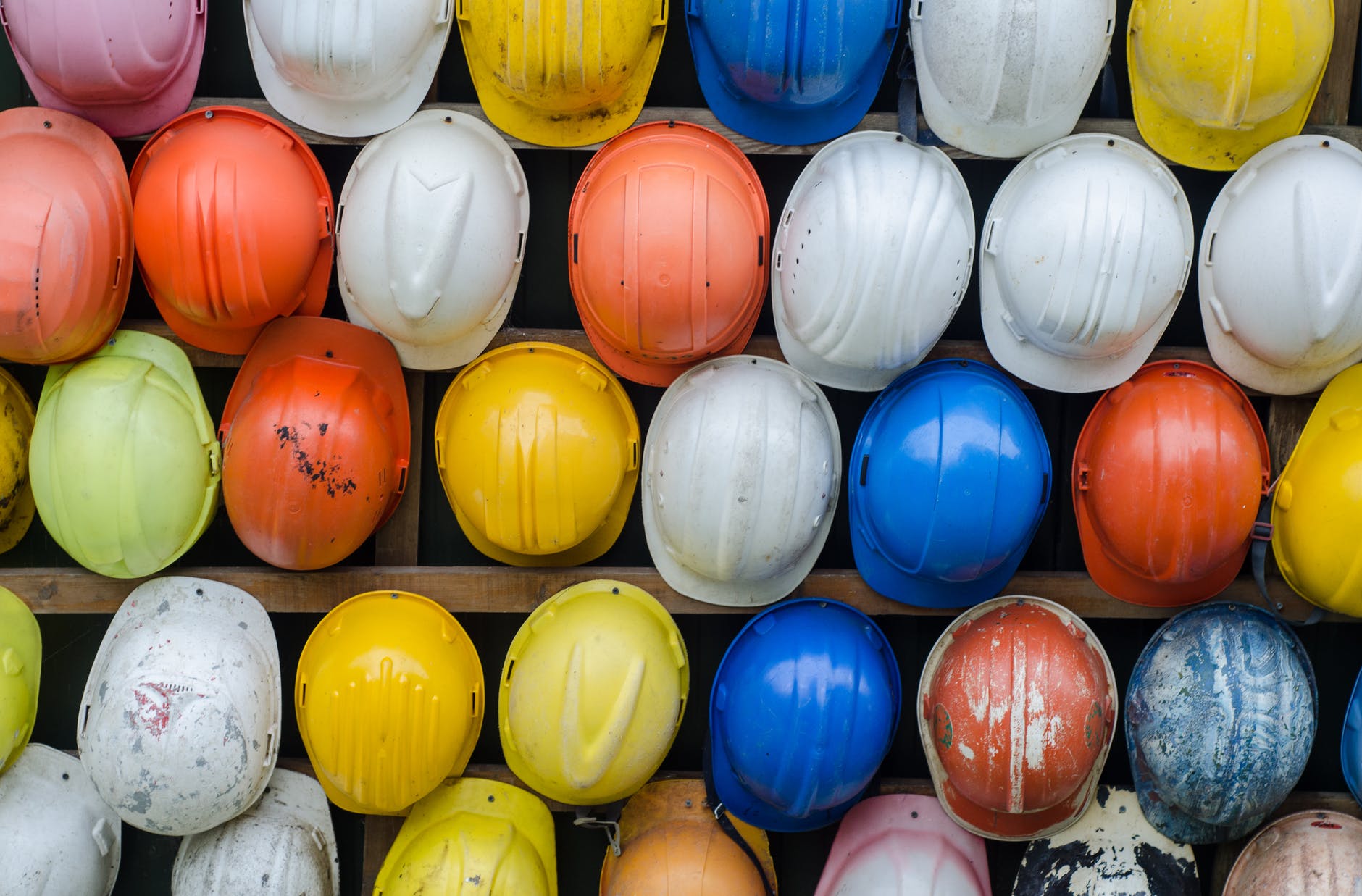 Safety helmets arranged on a wall