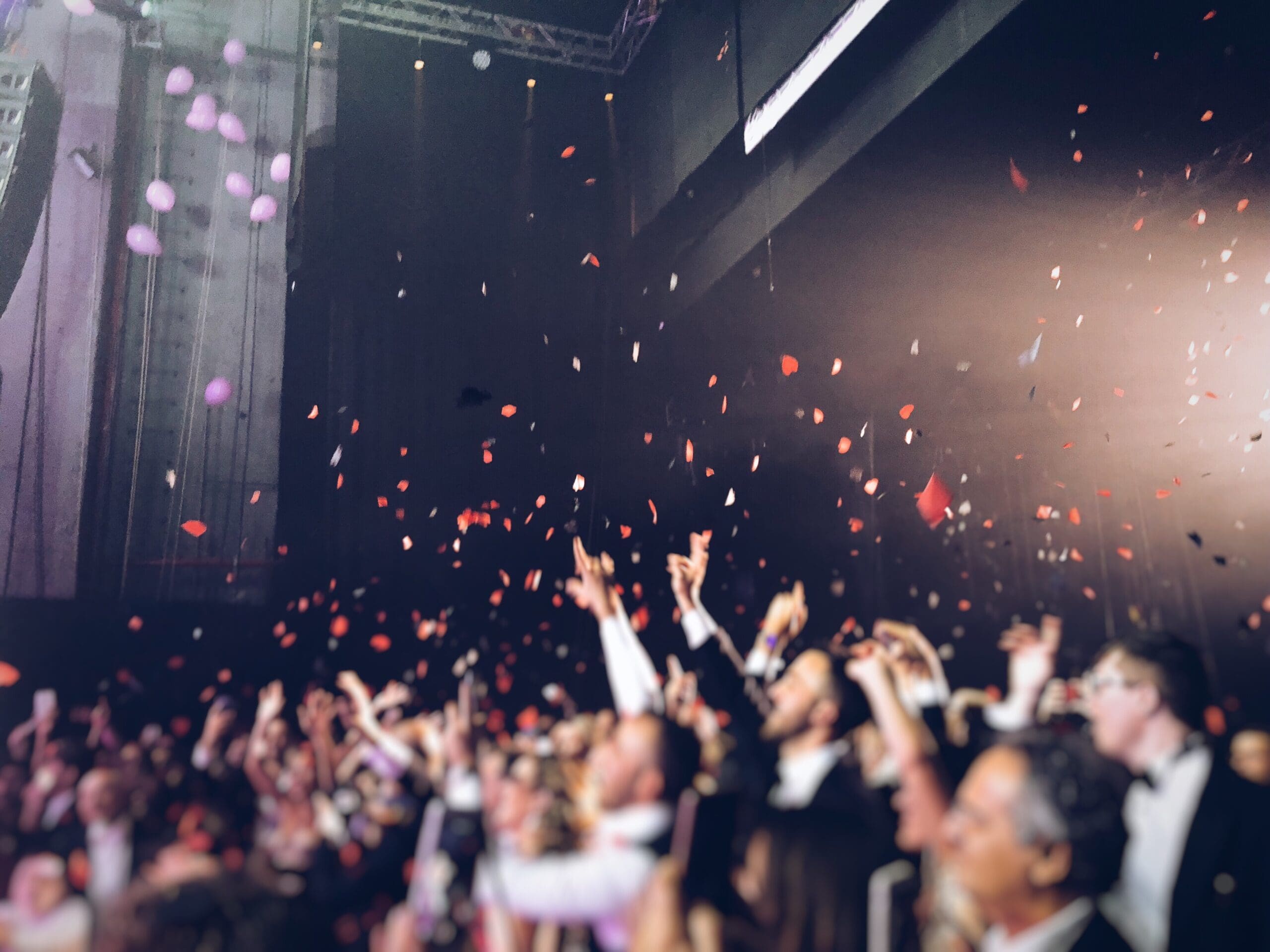 Crowd celebrating an awards ceremony with confetti